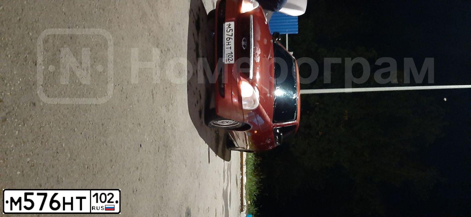 Фото автомобиля LADA 2172 PRIORA, 2009 — госномер Е233НК702. Цвет: ЗОЛОТИСТО-КРАСНЫЙ