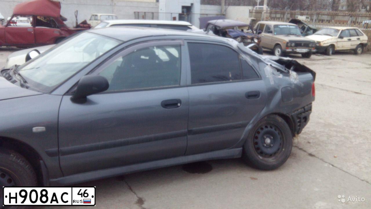 Фото автомобиля MITSUBISHI CARISMA, 2002 — госномер Н908АС46. Цвет: СЕРЫЙ