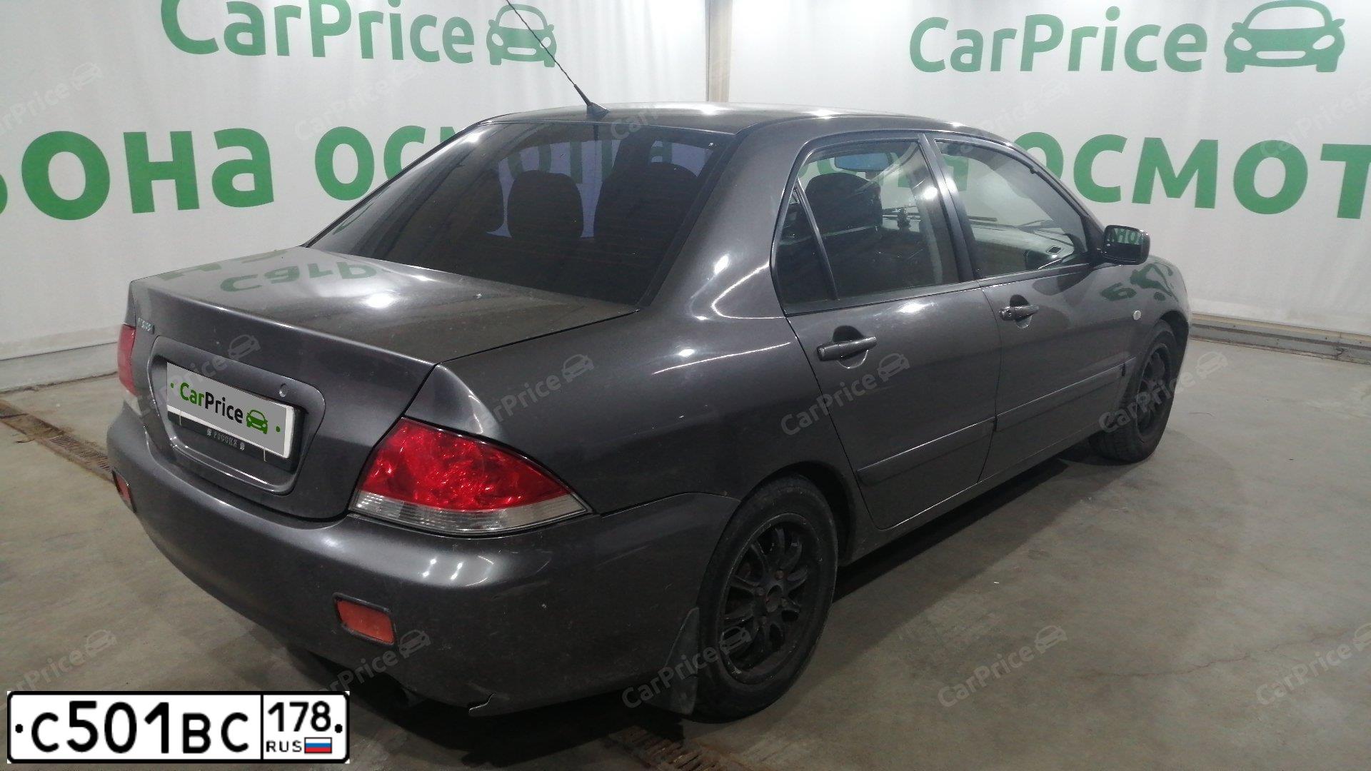 Фото автомобиля MITSUBISHI LANCER, 2005 — госномер М945ХР198. Цвет: СЕРЫЙ
