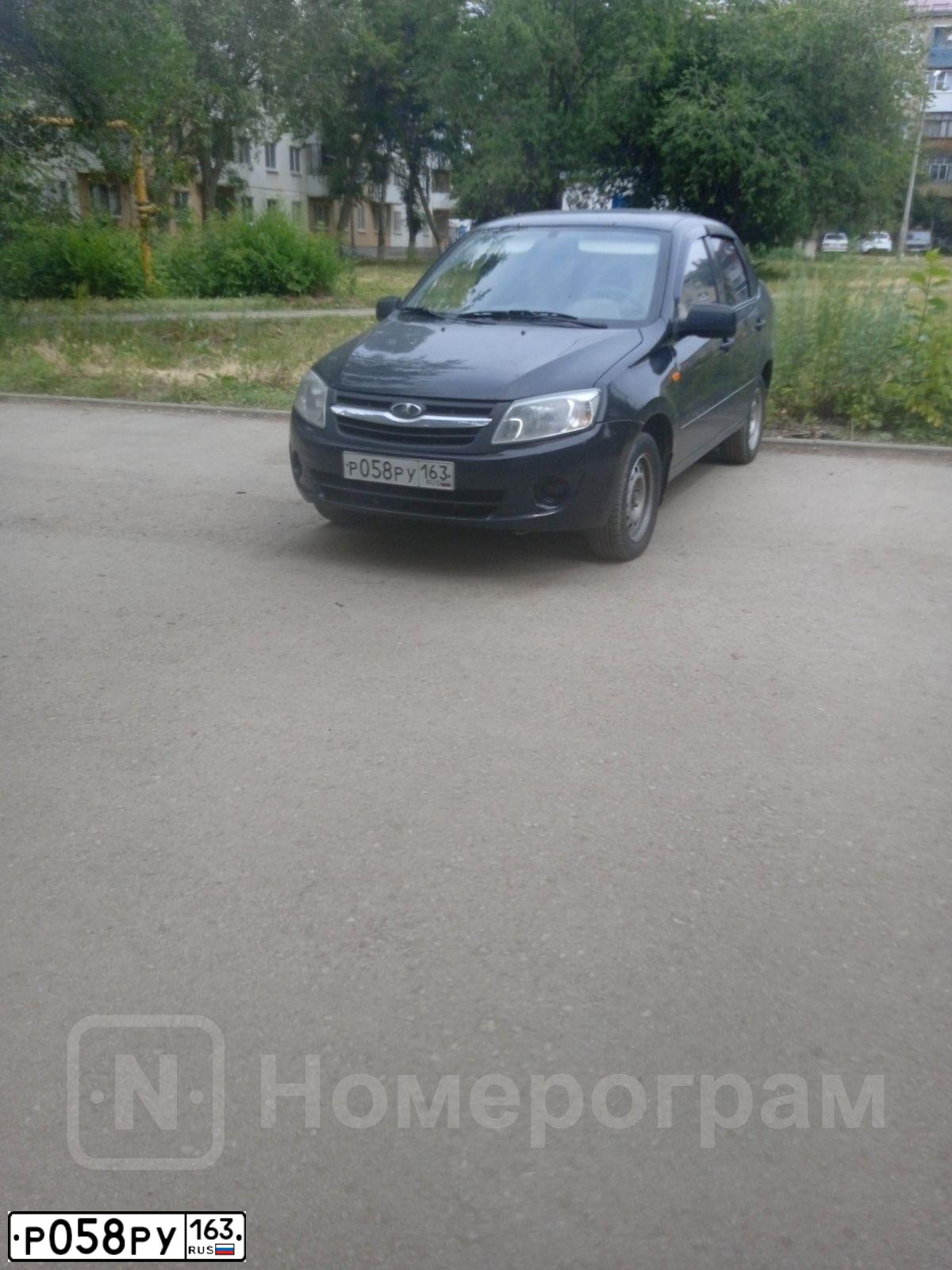 Фото автомобиля LADA 2190 GRANTA, 2012 — госномер Р058РУ163. Цвет: Сине-Черный