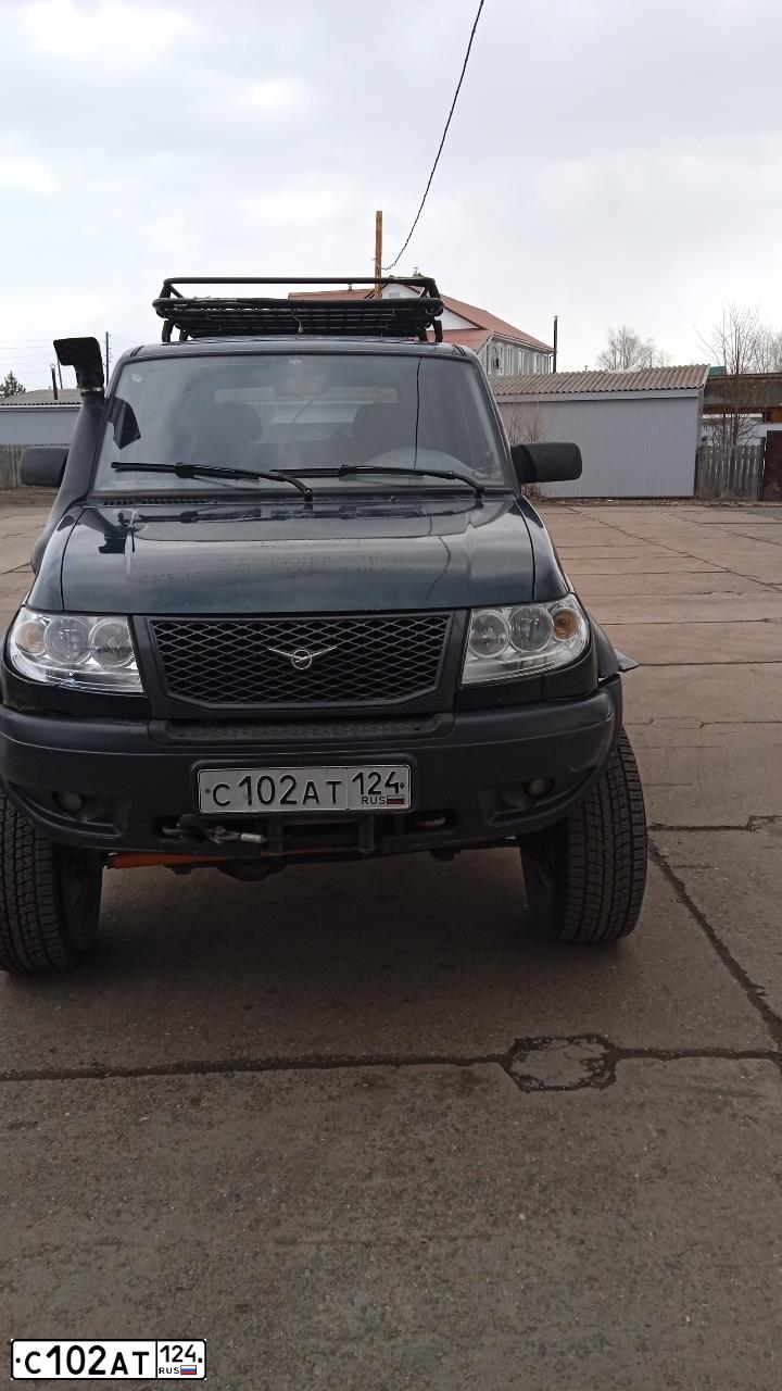 Фото автомобиля UAZ 3163 PATRIOT, 2010 — госномер С102АТ124. Цвет: ЗЕЛЕНЫЙ