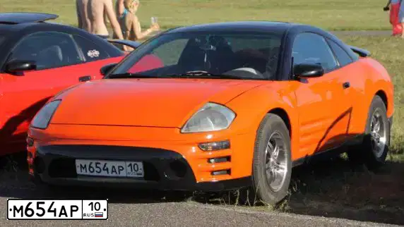 Фото автомобиля MITSUBISHI ECLIPSE, 2003 — госномер С431ТТ790. Цвет: Оранжевый