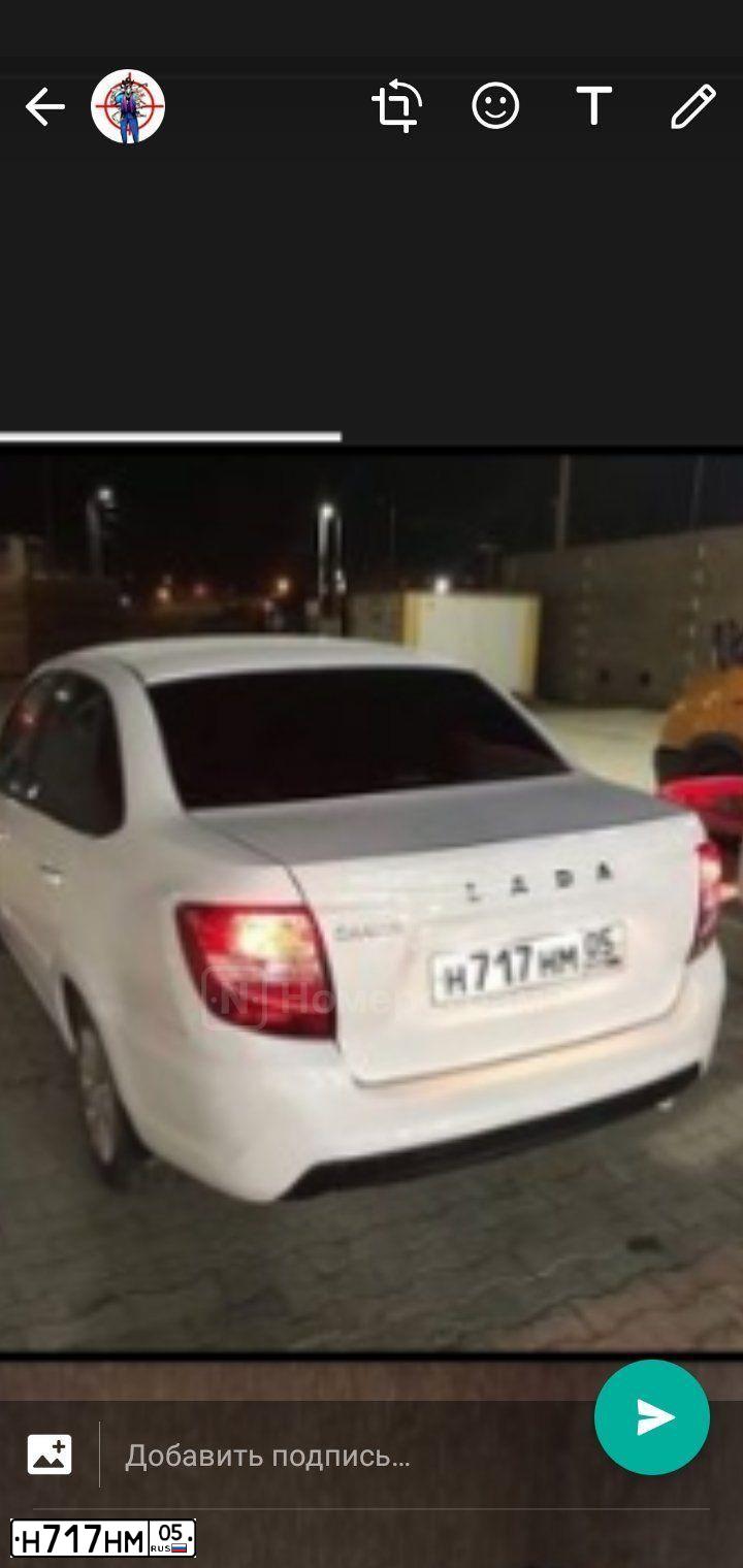 Фото автомобиля LADA 2190 GRANTA, 2019 — госномер Н717НМ05. Цвет: БЕЛАЯ