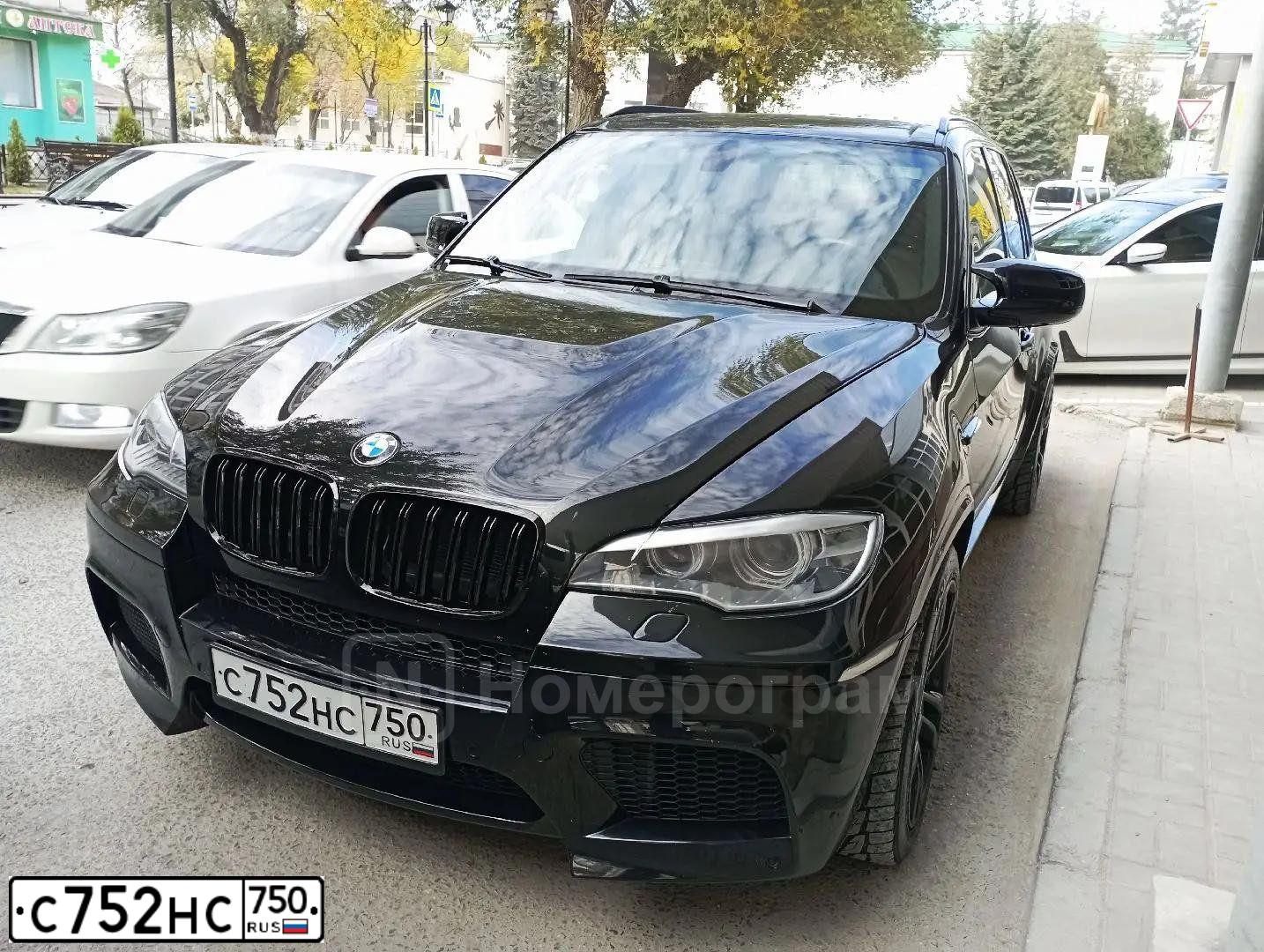 Фото автомобиля BMW X5, 2010 — госномер В140НТ92. Цвет: ЧЕРНЫЙ