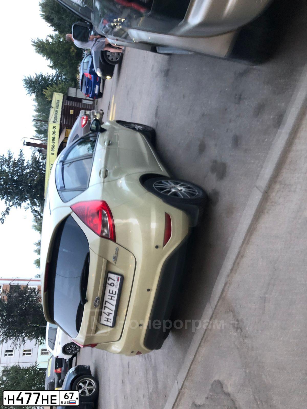 Фото автомобиля FORD FIESTA / ASPIRE, 2009 — госномер Н477НЕ67. Цвет: ЖЕЛТО-САЛАТОВЫЙ