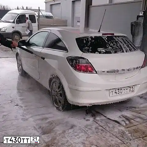 Фото автомобиля OPEL ASTRA, 2010 — госномер Т430ТТ21. Цвет: Белый