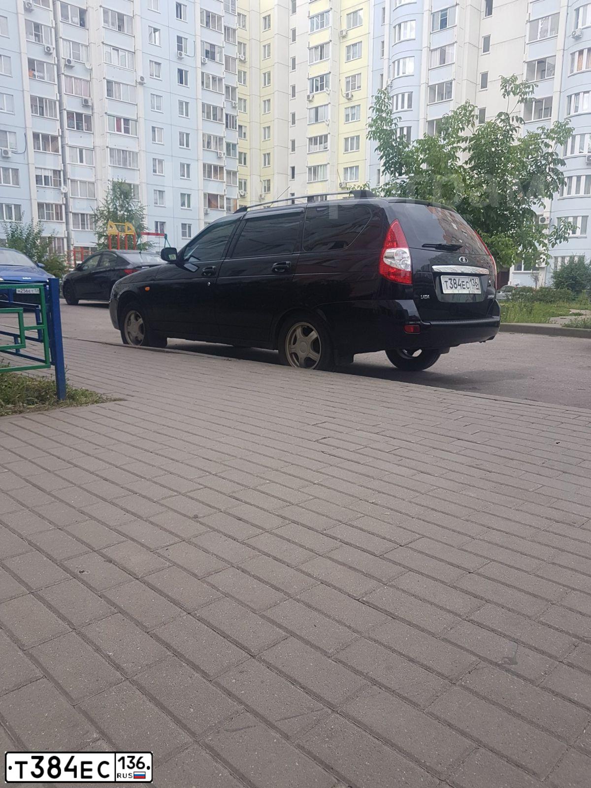 Фото автомобиля LADA 2171 PRIORA, 2011 — госномер Т282ХМ47. Цвет: СИНЕ-ЧЕРНЫЙ