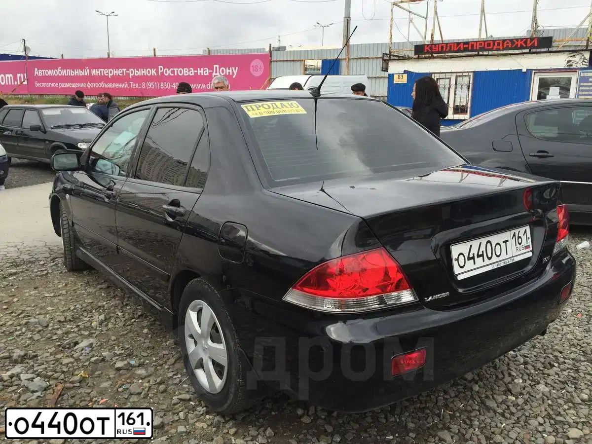 Фото автомобиля MITSUBISHI LANCER, 2006 — госномер О440ОТ161. Цвет: ЧЕРНЫЙ