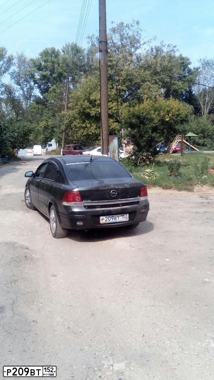 Фото автомобиля OPEL ASTRA, 2009 — госномер Р209ВТ152. Цвет: ЧЕРНЫЙ