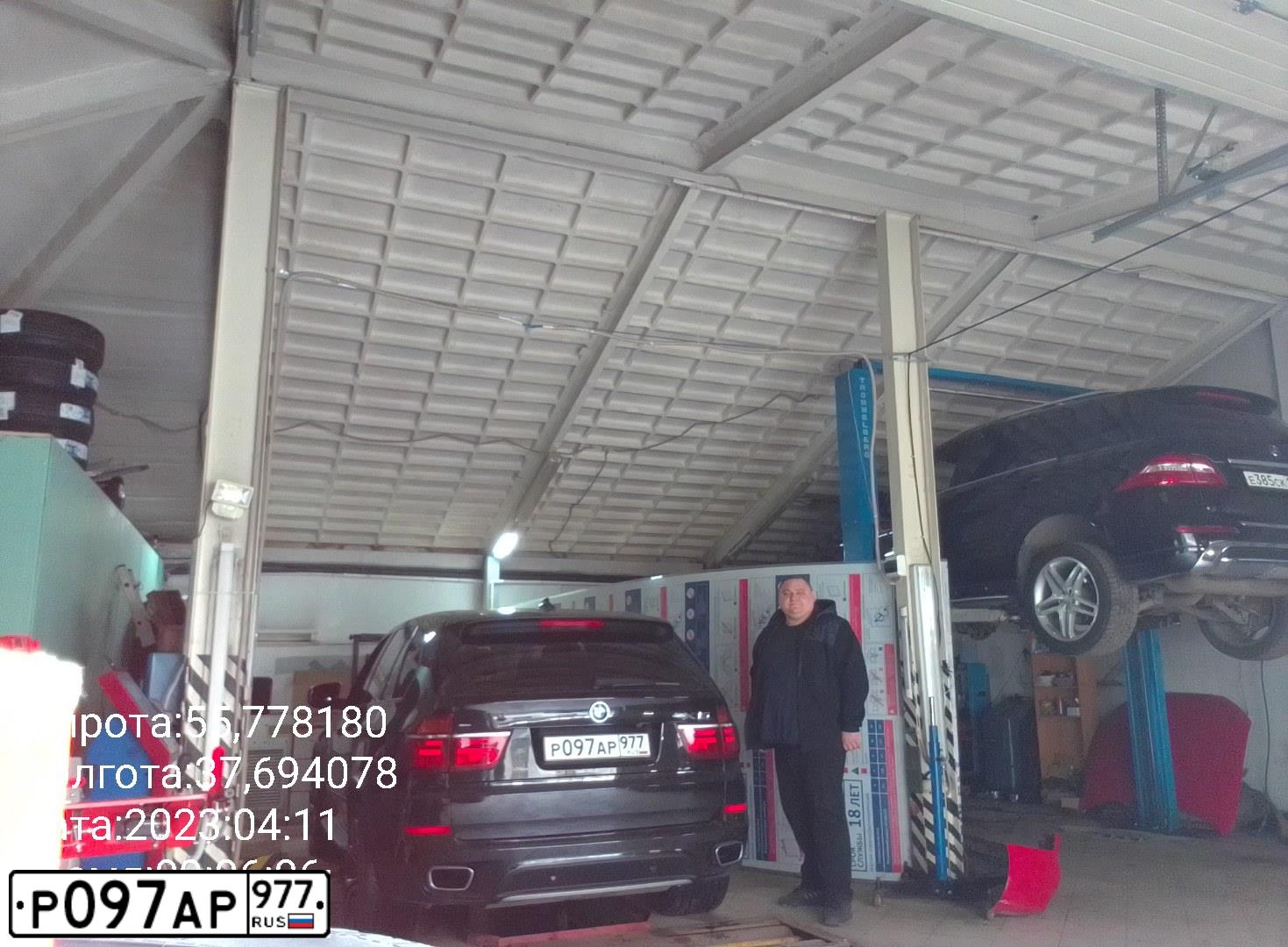Фото автомобиля BMW X5, 2010 — госномер Р097АР977. Цвет: ЧЕРНЫЙ