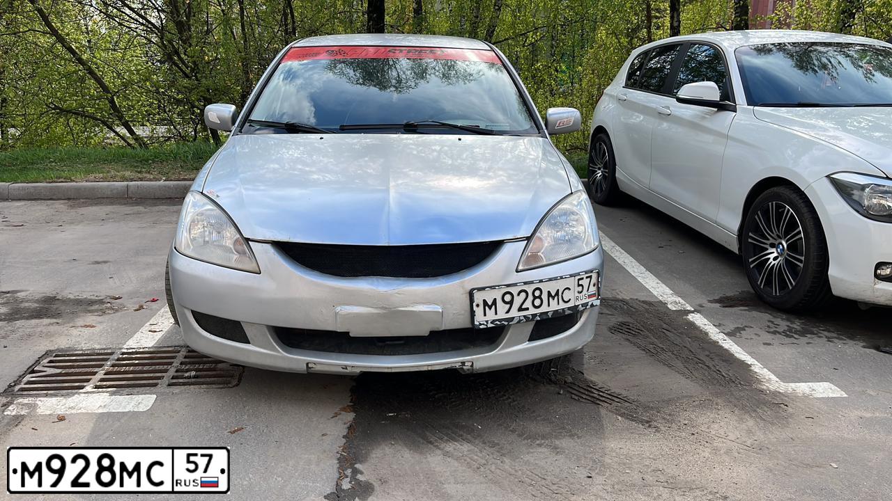 Фото автомобиля MITSUBISHI LANCER, 2004 — госномер Х765ОМ37. Цвет: СЕРЕБРИСТЫЙ