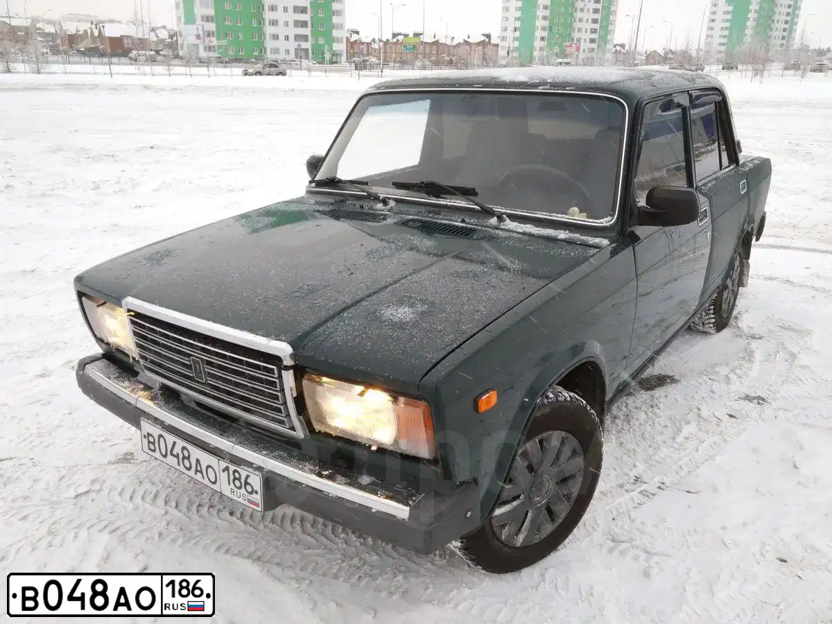 Фото автомобиля LADA 2107, 2006 — госномер М402НУ186. Цвет: ЧЕРНО-ЗЕЛЕНЫЙ