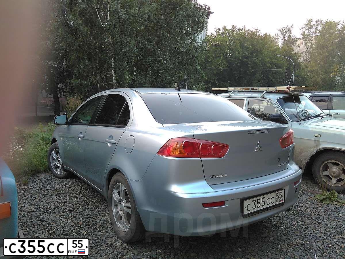 Фото автомобиля MITSUBISHI LANCER, 2009 — госномер О786ОО55. Цвет: Серебристый