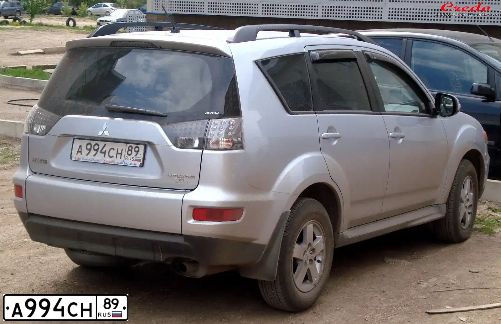 Фото автомобиля MITSUBISHI OUTLANDER, 2011 — госномер Т155ХВ72. Цвет: серебристый