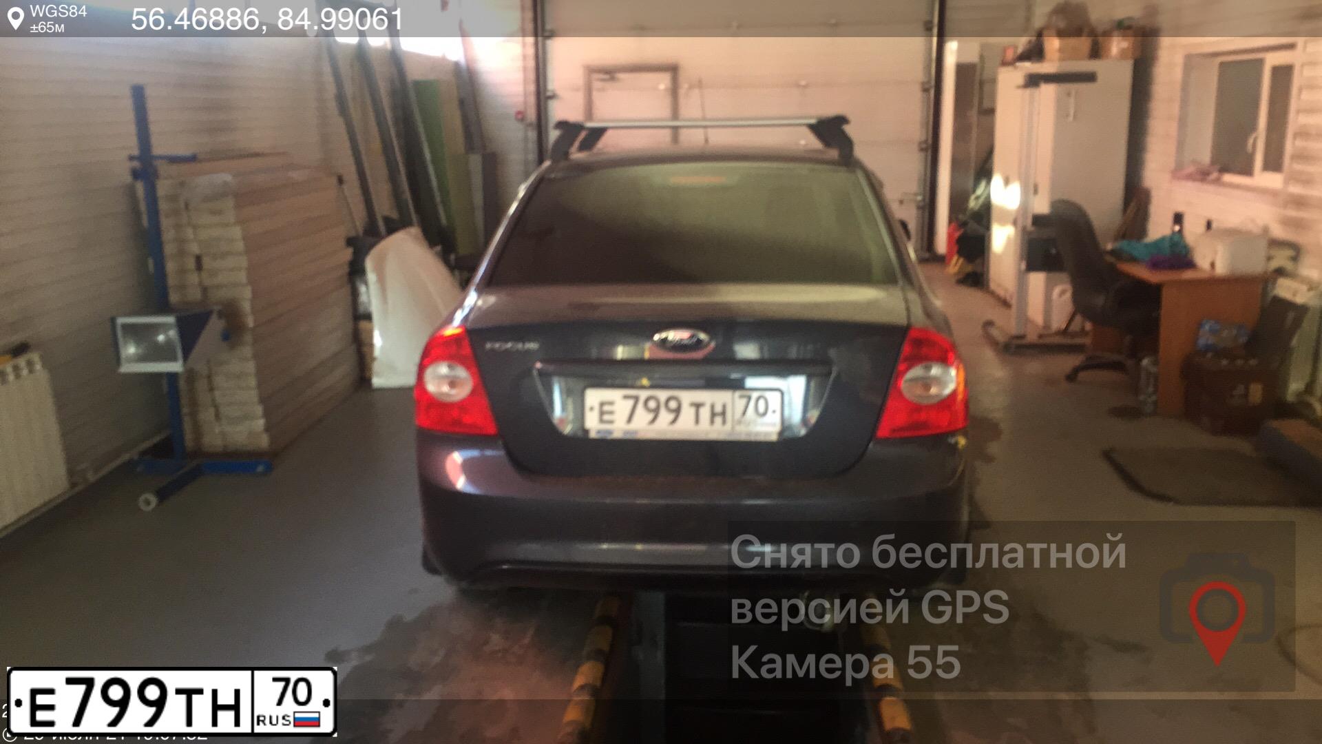 Фото автомобиля FORD FOCUS, 2010 — госномер Е799ТН70. Цвет: ТЕМНО-СЕРЫЙ