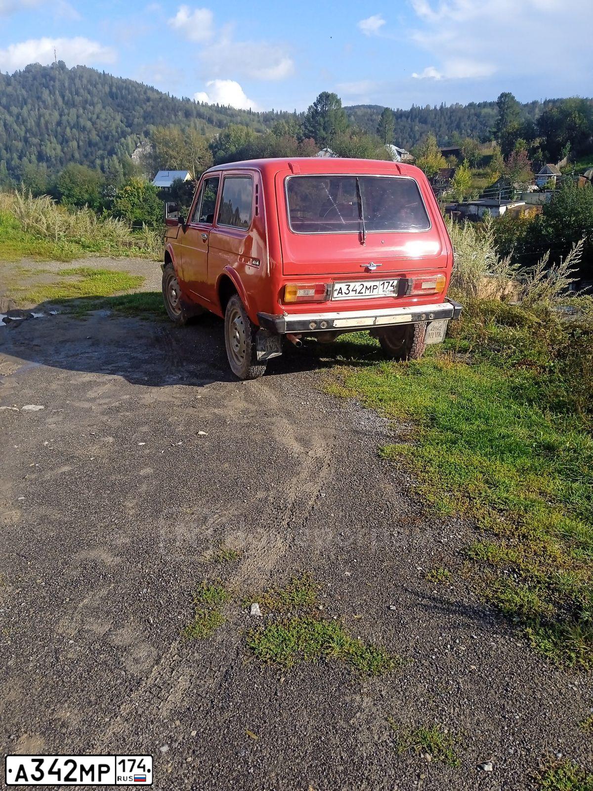 Фото автомобиля LADA 2121 NIVA, 1991 — госномер А342МР174. Цвет: Красный
