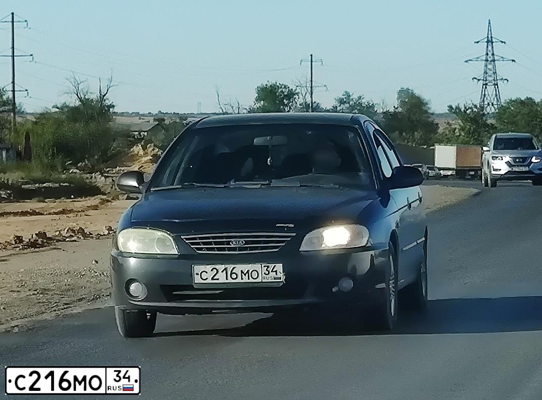 Фото автомобиля KIA SPECTRA, 2006 — госномер С216МО34. Цвет: ЧЕРНЫЙ
