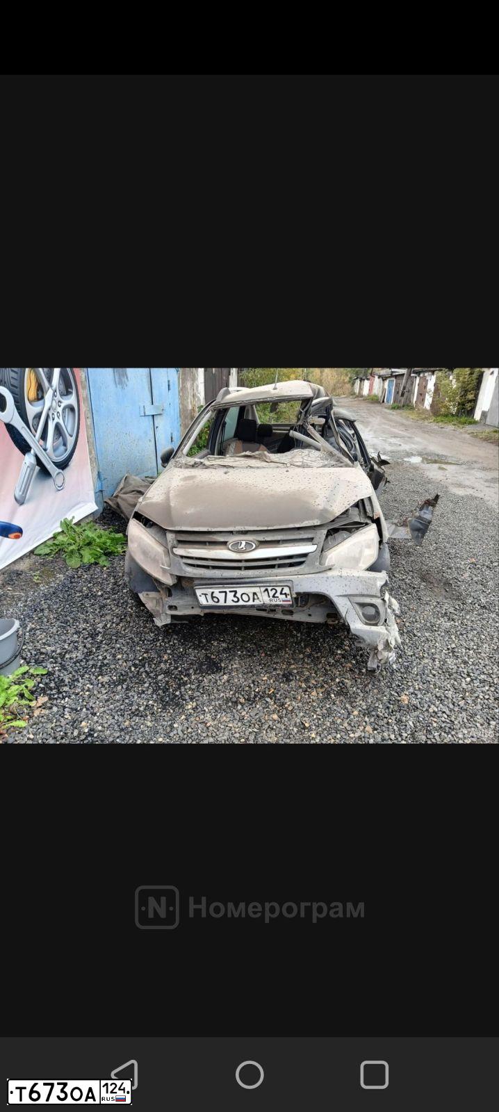 Фото автомобиля LADA 2190 GRANTA, 2016 — госномер Т673ОА124. Цвет: серебристо-темно-серый