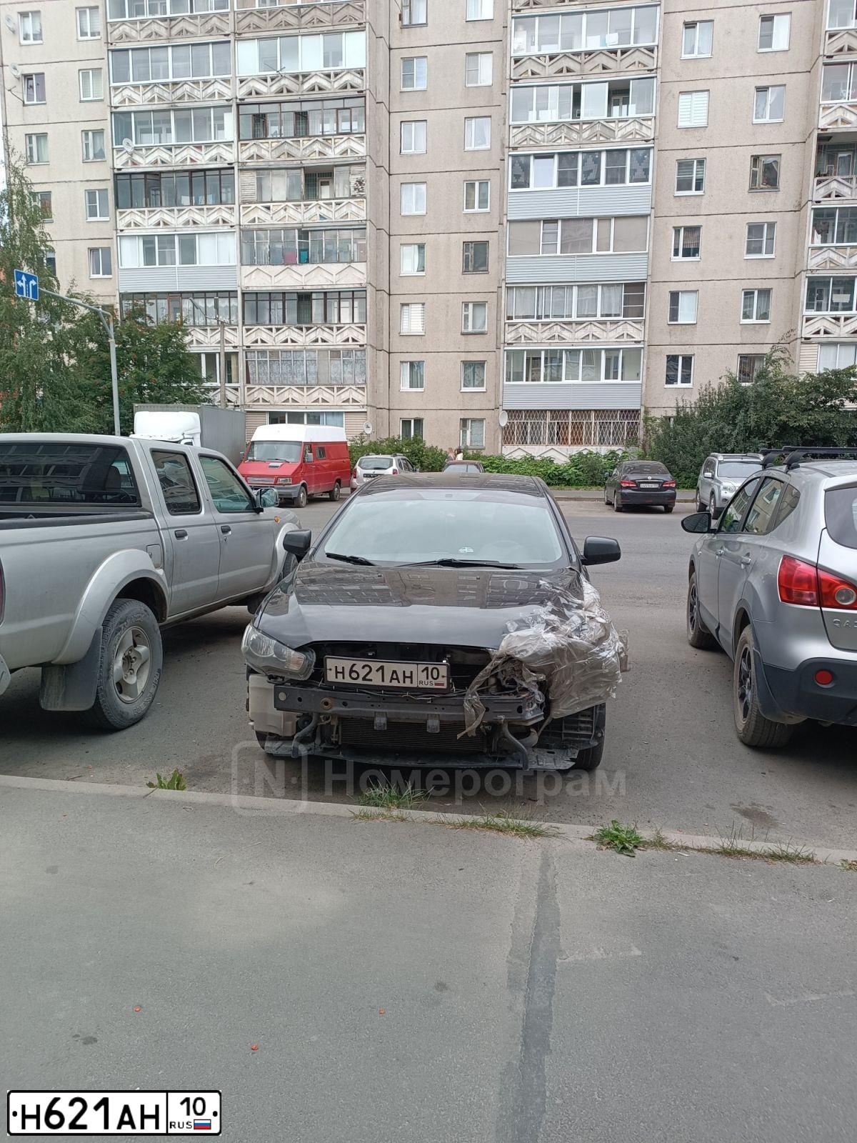 Фото автомобиля MITSUBISHI LANCER, 2010 — госномер Н621АН10. Цвет: ЧЕРНЫЙ