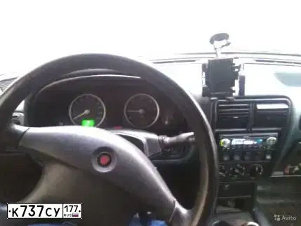 Фото автомобиля GAZ 3110 WOLGA, 2006 — госномер К127СЕ21. Цвет: ЧЕРНЫЙ