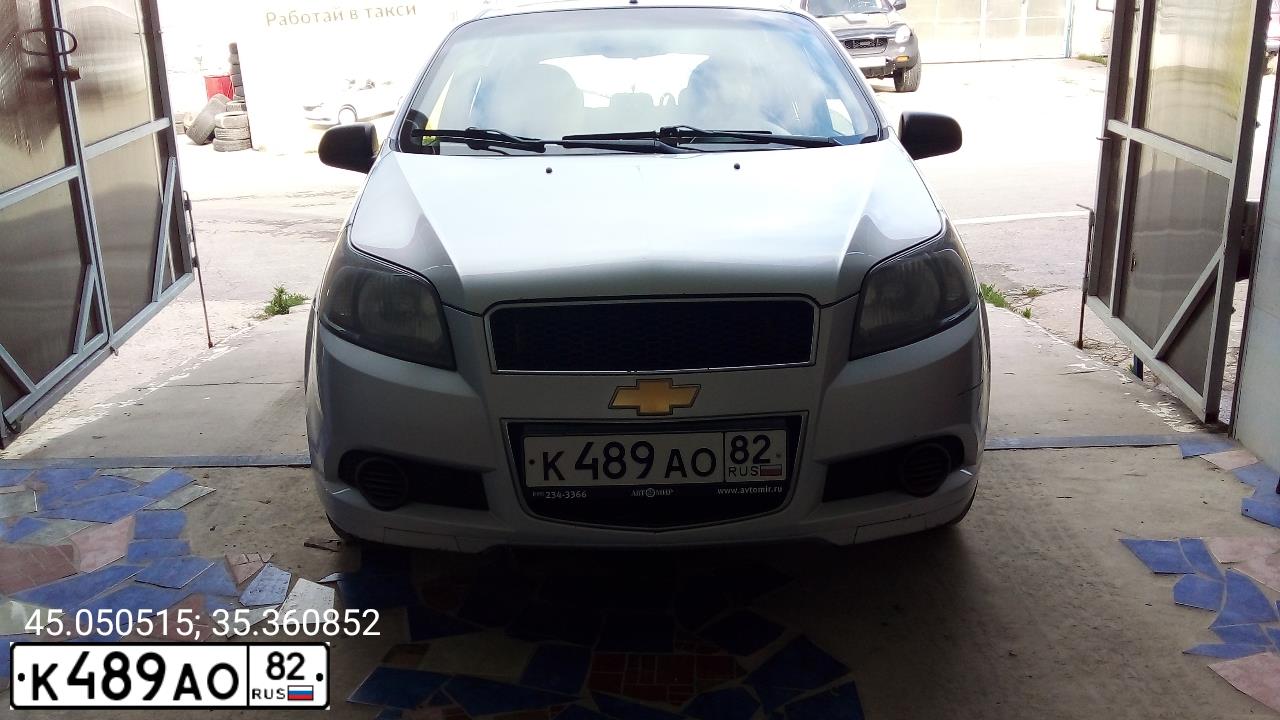 Фото автомобиля CHEVROLET AVEO, 2011 — госномер Н072НС82. Цвет: СЕРЫЙ