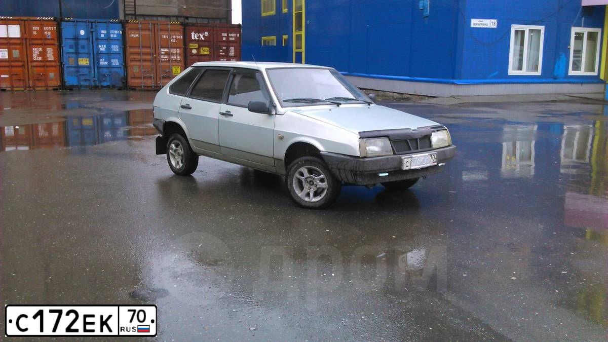 Фото автомобиля TOYOTA RAV4, 2011 — госномер Е100ОЕ70. Цвет: ЧЕРНЫЙ