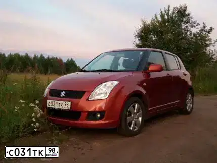 Фото автомобиля СУЗУКИ SWIFT, 2007 — госномер Т076ТР198. Цвет: Оранжевый