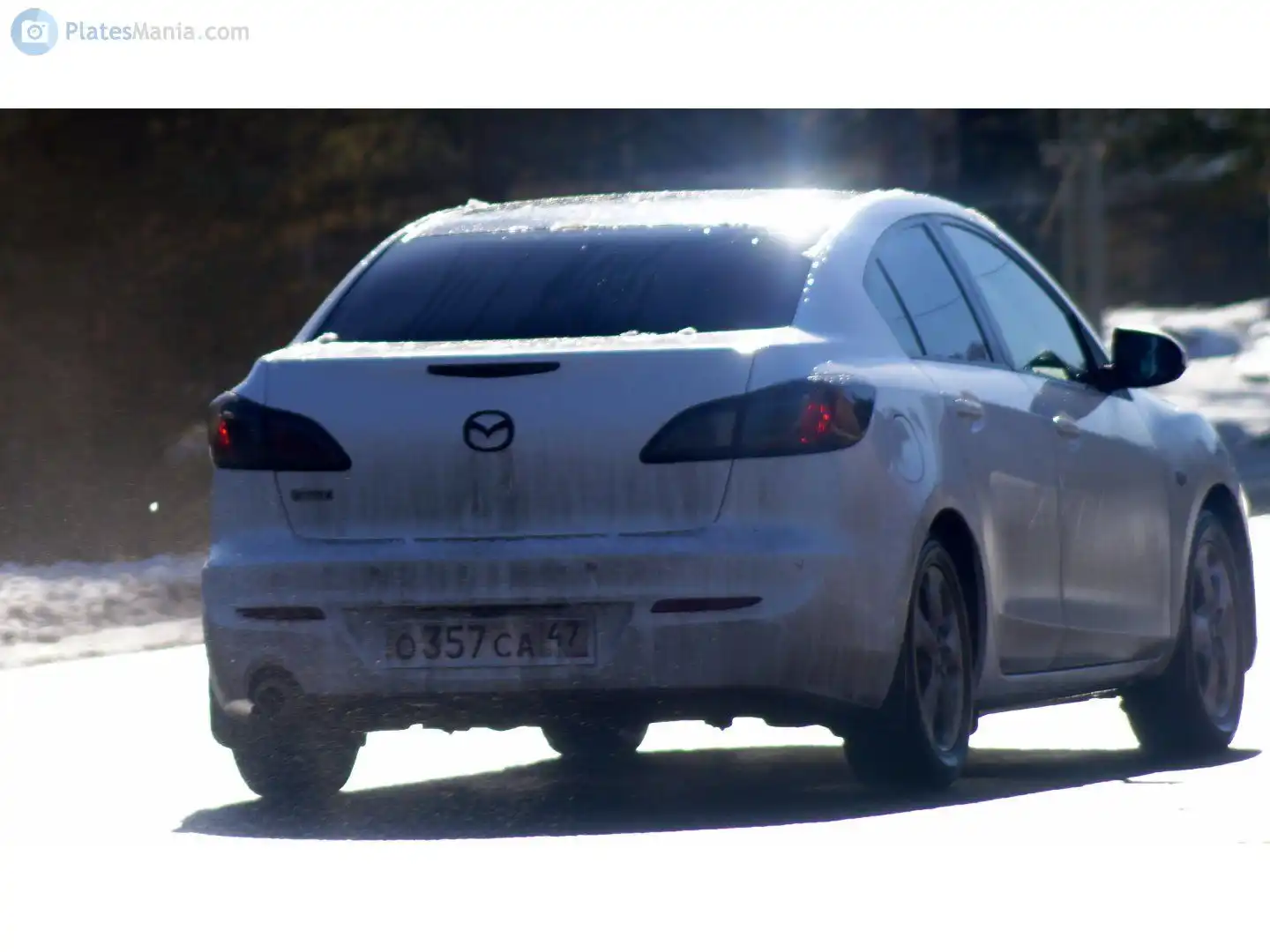 Фото автомобиля MAZDA A 3, 2012 — госномер О357СА47. Цвет: Белый