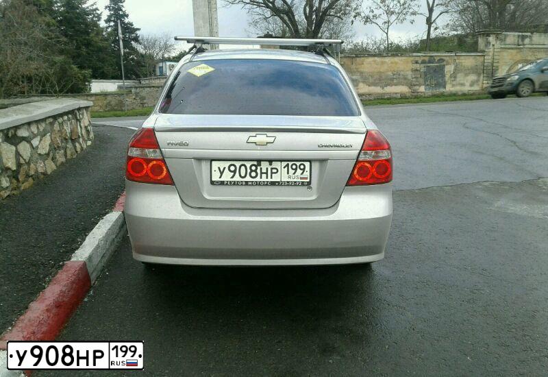 Фото автомобиля CHEVROLET AVEO, 2008 — госномер У908НР199. Цвет: серебристый