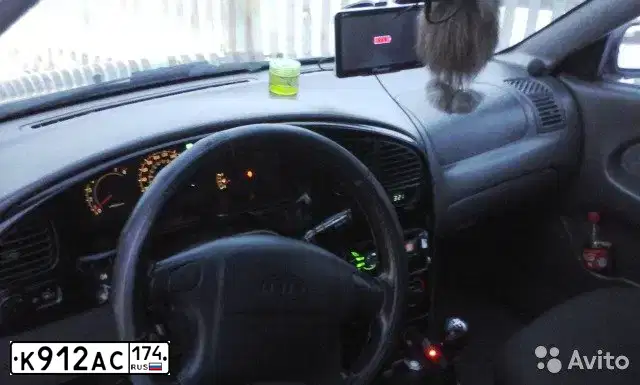 Фото автомобиля KIA SPECTRA, 2007 — госномер К912АС174. Цвет: ТЕМНО-СИНИЙ