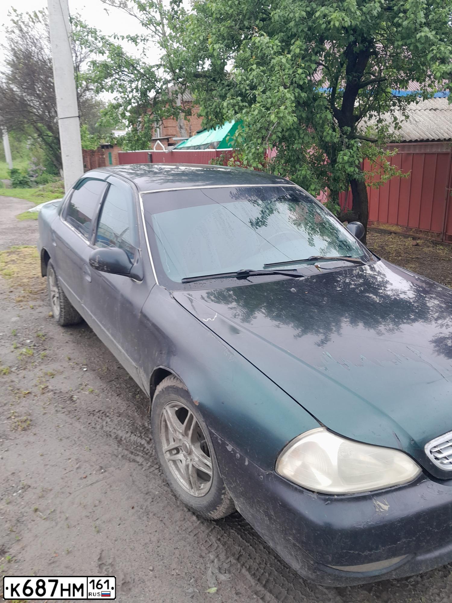 Фото автомобиля KIA CLARUS, 1998 — госномер К687НМ161. Цвет: Т.ЗЕЛЕНЫЙ