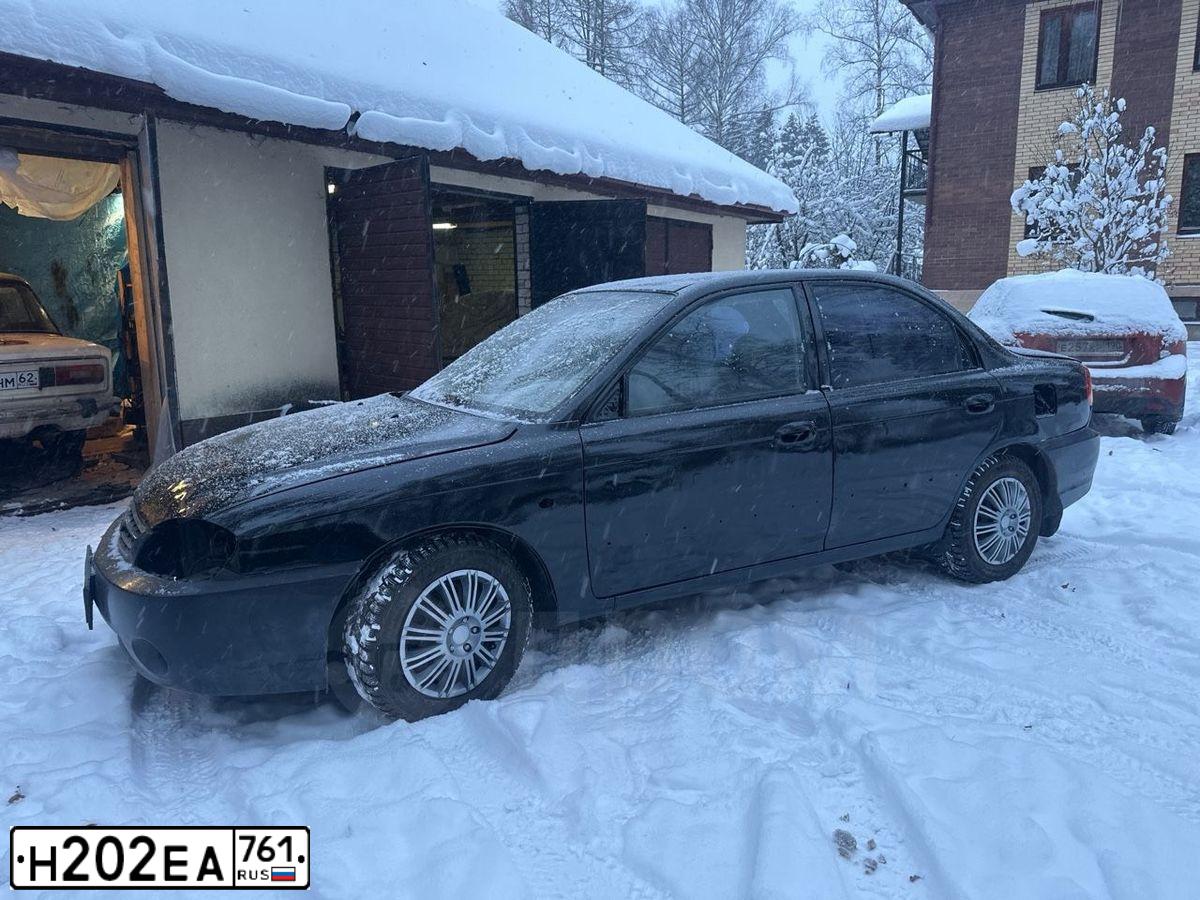 Фото автомобиля KIA SPECTRA, 2006 — госномер Н202ЕА761. Цвет: ЧЕРНЫЙ