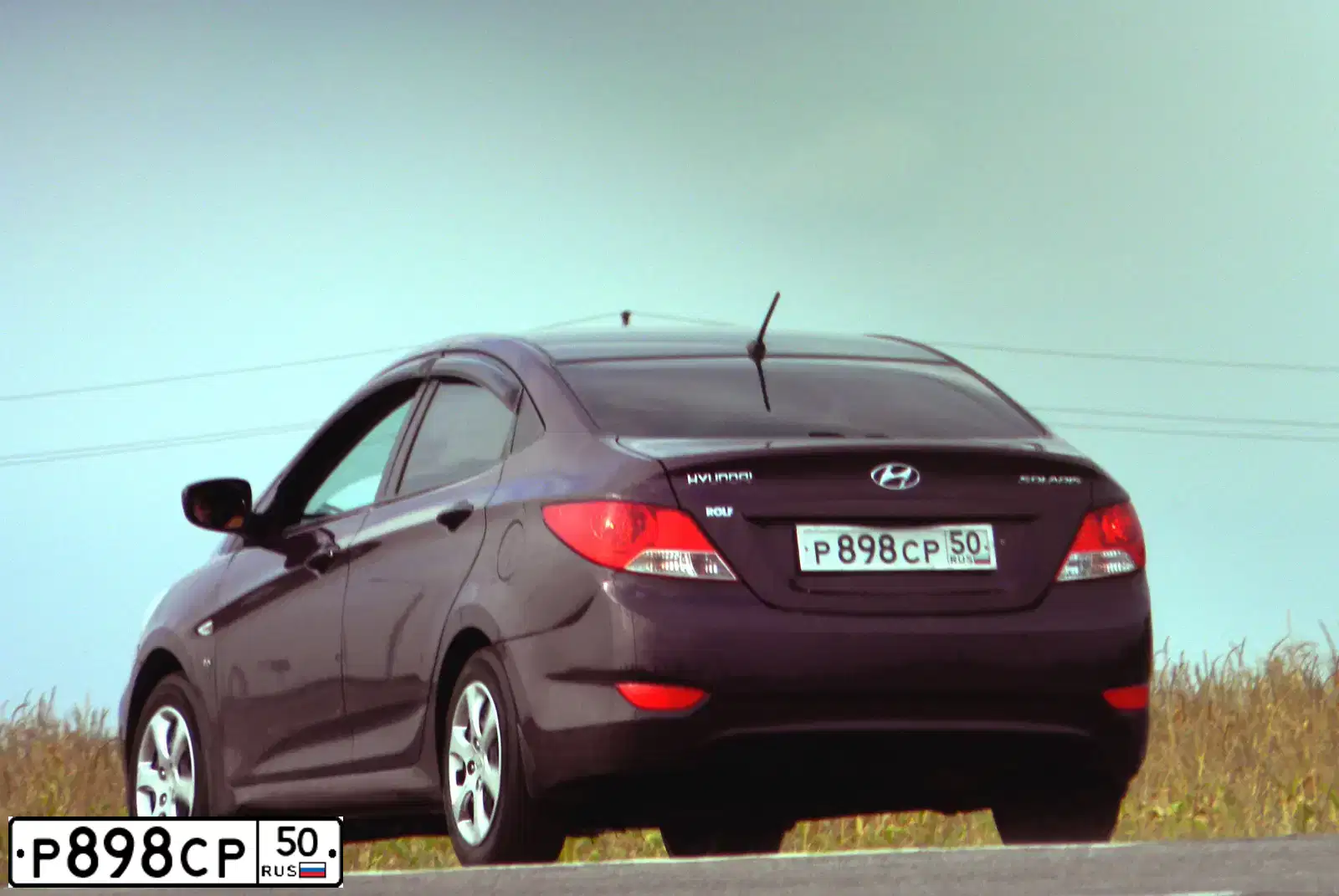 Фото автомобиля HYUNDAI SOLARIS, 2011 — госномер Н698ОК32. Цвет: ФИОЛЕТОВЫЙ