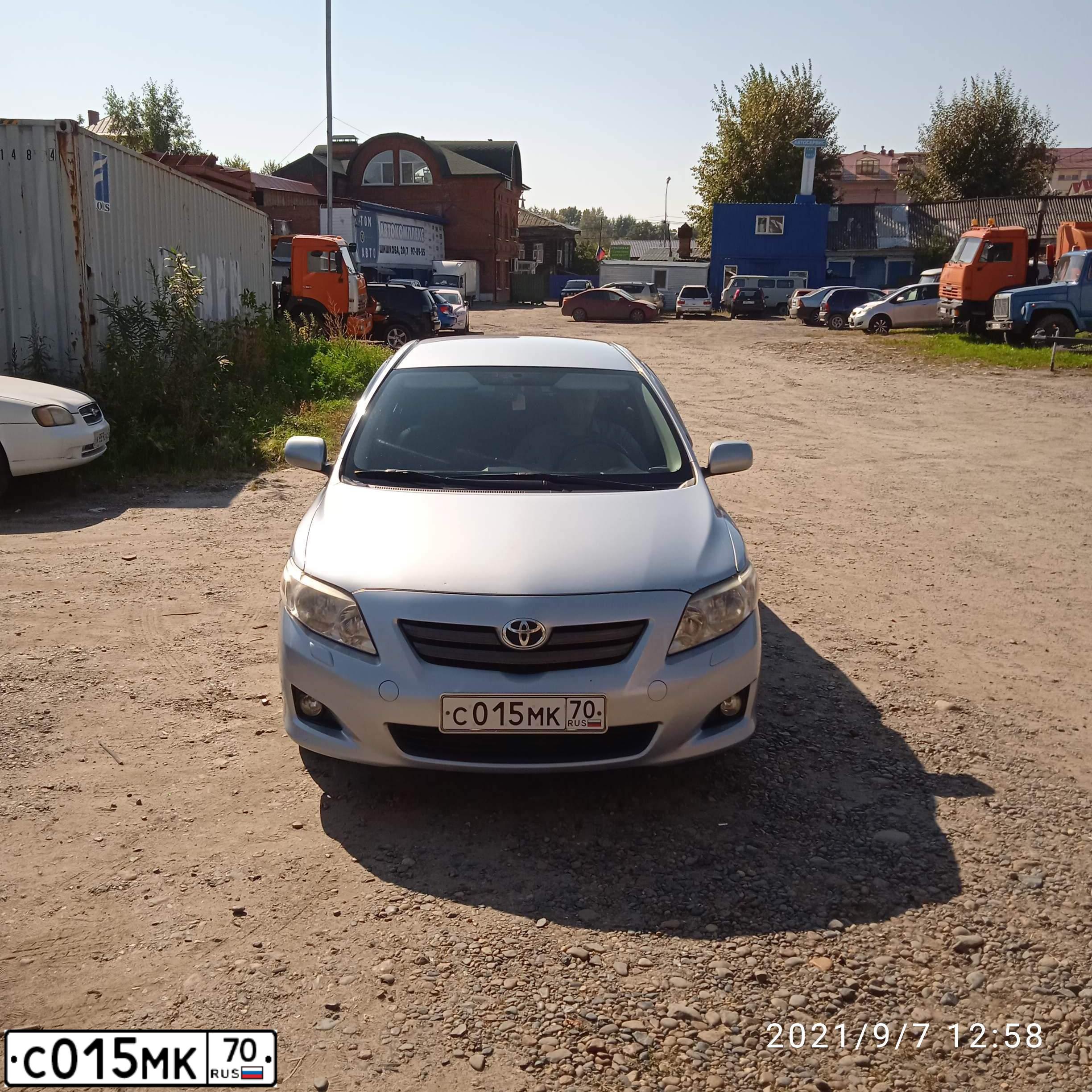 Фото автомобиля TOYOTA COROLLA, 2007 — госномер С015МК70. Цвет: СВЕТЛО-ГОЛУБОЙ