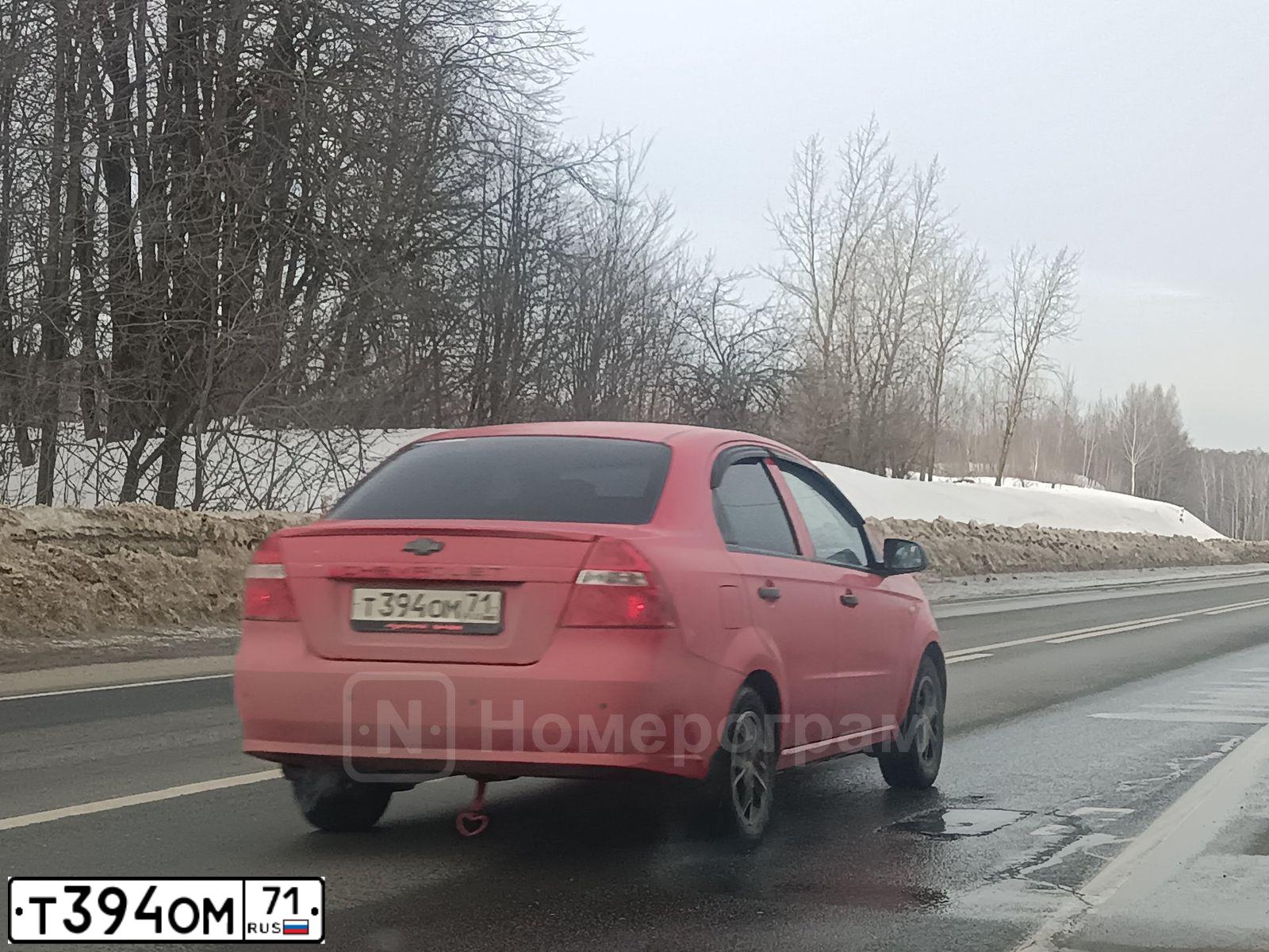 Фото автомобиля CHEVROLET AVEO, 2009 — госномер Т394ОМ71. Цвет: Красный