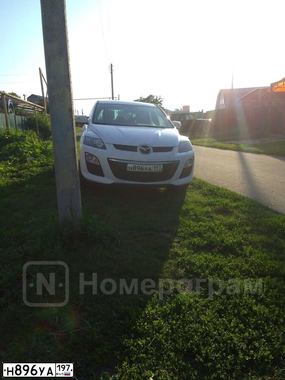 Фото автомобиля MAZDA CX-7, 2011 — госномер Н896УА197. Цвет: Белый