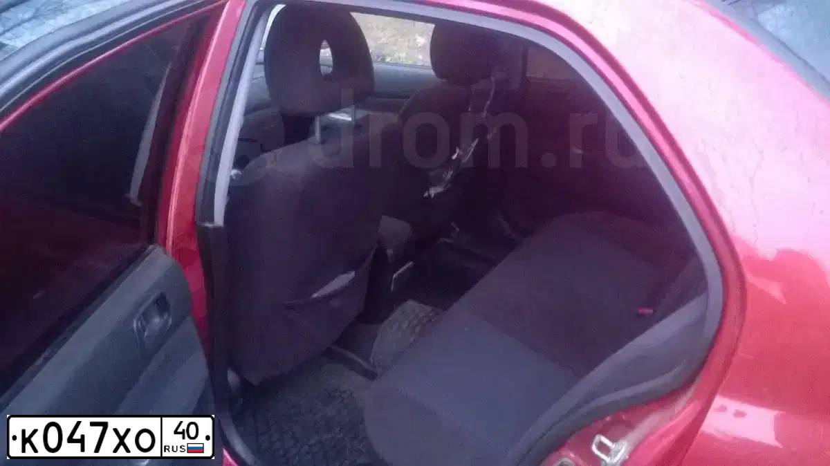 Фото автомобиля MITSUBISHI LANCER, 2005 — госномер К047ХО40. Цвет: Красный