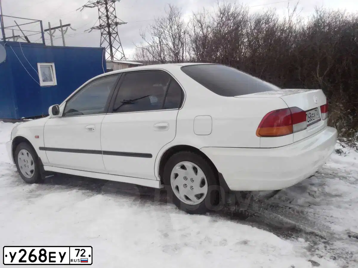 Фото автомобиля CHEVROLET AVEO, 2013 — госномер У268ЕУ72. Цвет: ЧЕРНЫЙ МЕТАЛЛИК