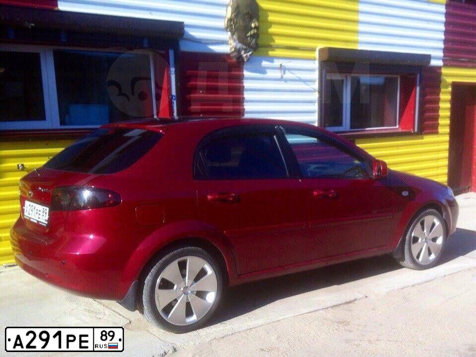 Фото автомобиля CHEVROLET LACETTI, 2012 — госномер А102НА45. Цвет: Красный