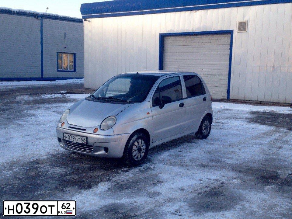 Фото автомобиля DAEWOO MATIZ, 2004 — госномер Н039ОТ62. Цвет: БЕЛЫЙ(СВЕТЛО-СЕРЫЙ)