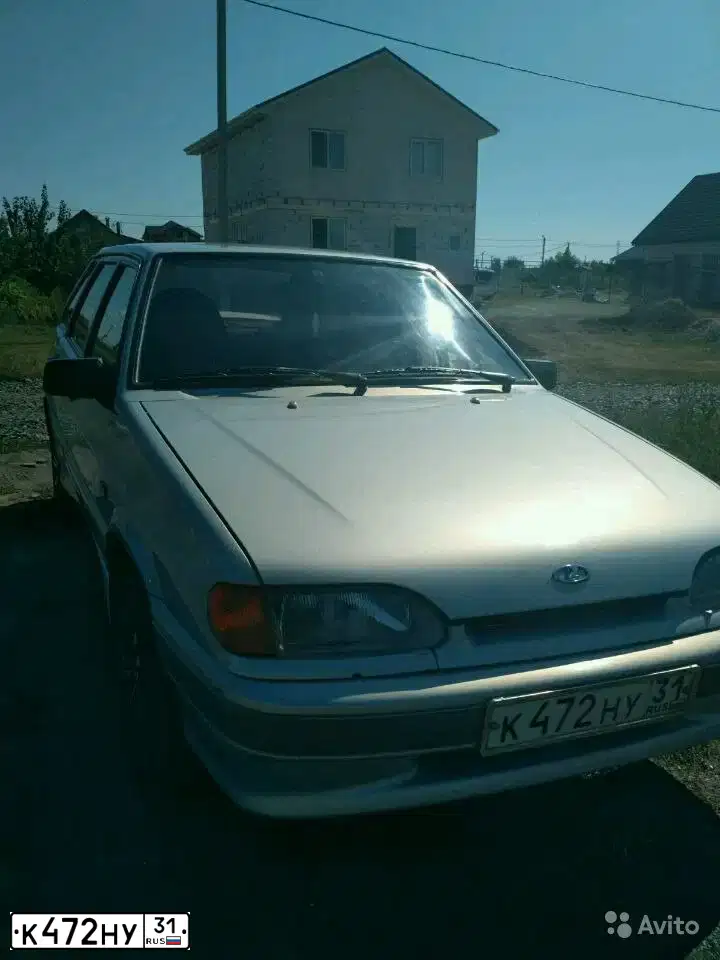 Фото автомобиля LADA 2114 SAMARA, 2005 — госномер К472НУ31. Цвет: Серебристо-Желто-Голубой