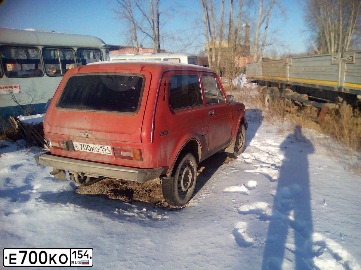 Фото автомобиля LADA 2121 NIVA, 1990 — госномер Е700КО154. Цвет: ЧЕРНЫЙ