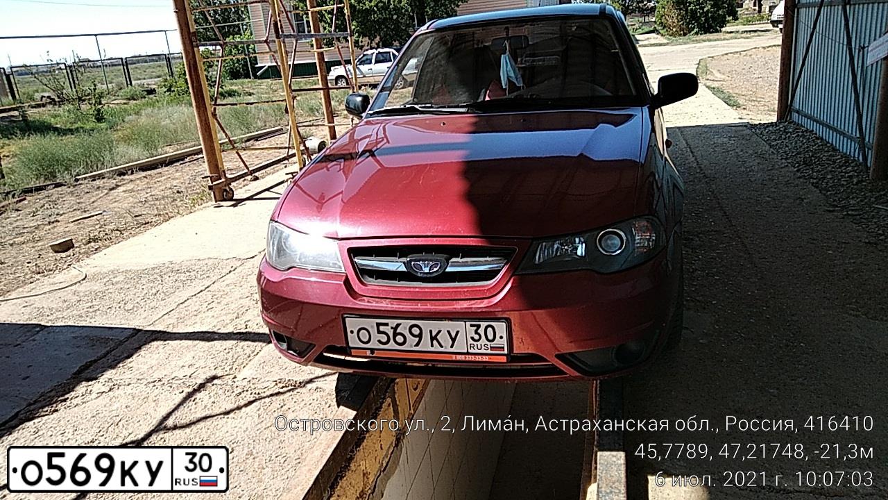 Фото автомобиля DAEWOO O NEXIA, 2012 — госномер О569КУ30. Цвет: ВИШНЕВЫЙ