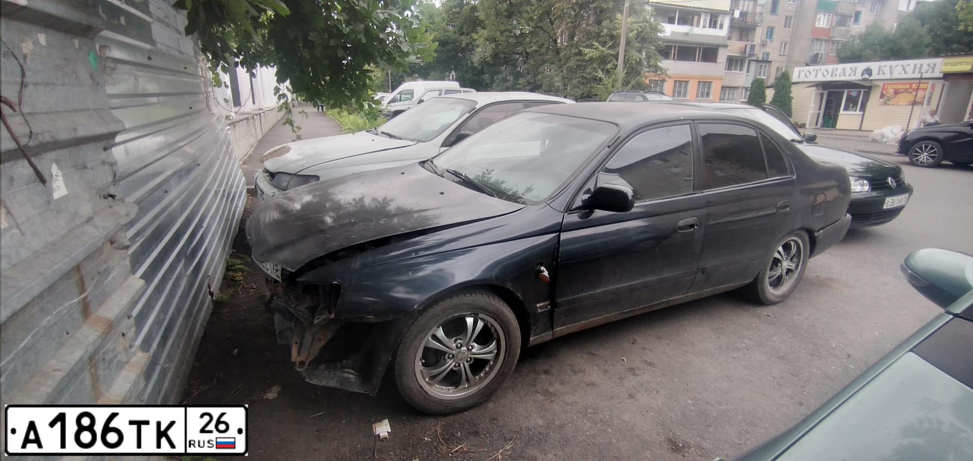 Фото автомобиля TOYOTA CARINA, 1993 — госномер Н135ЕС15. Цвет: синий