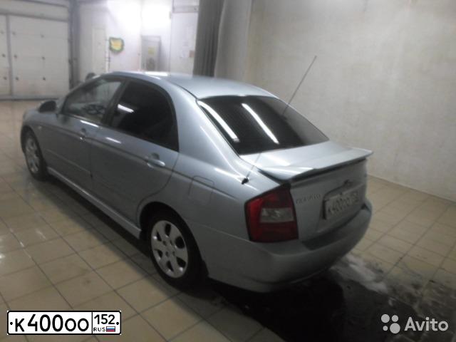 Фото автомобиля KIA CERATO, 2004 — госномер В001ЕТ152. Цвет: СВЕТЛО-ГОЛУБОЙ