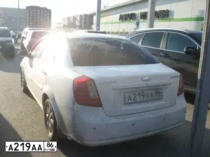 Фото автомобиля CHEVROLET LACETTI, 2007 — госномер А219АА86. Цвет: Белый