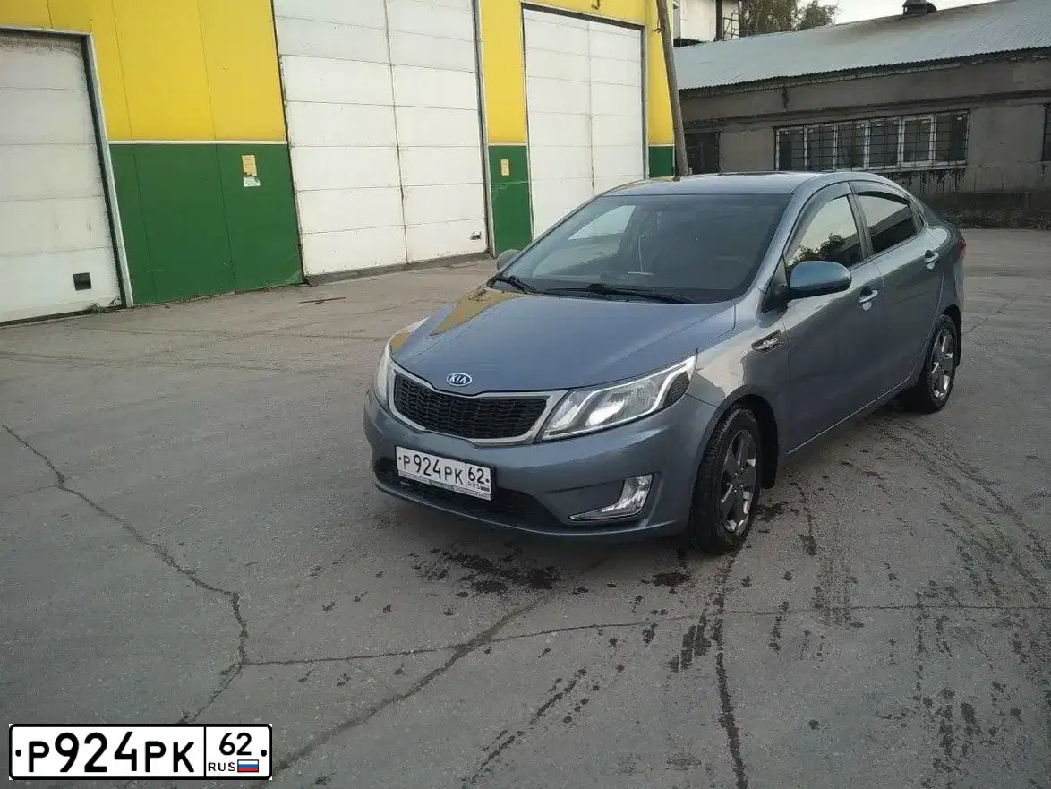 Фото автомобиля KIA RIO, 2012 — госномер О643ТХ62. Цвет: голубой