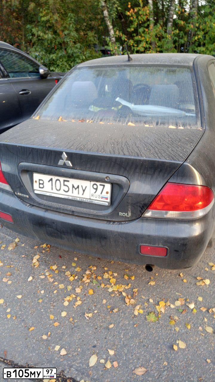 Фото автомобиля MITSUBISHI LANCER, 2003 — госномер В105МУ97. Цвет: СЕРЫЙ