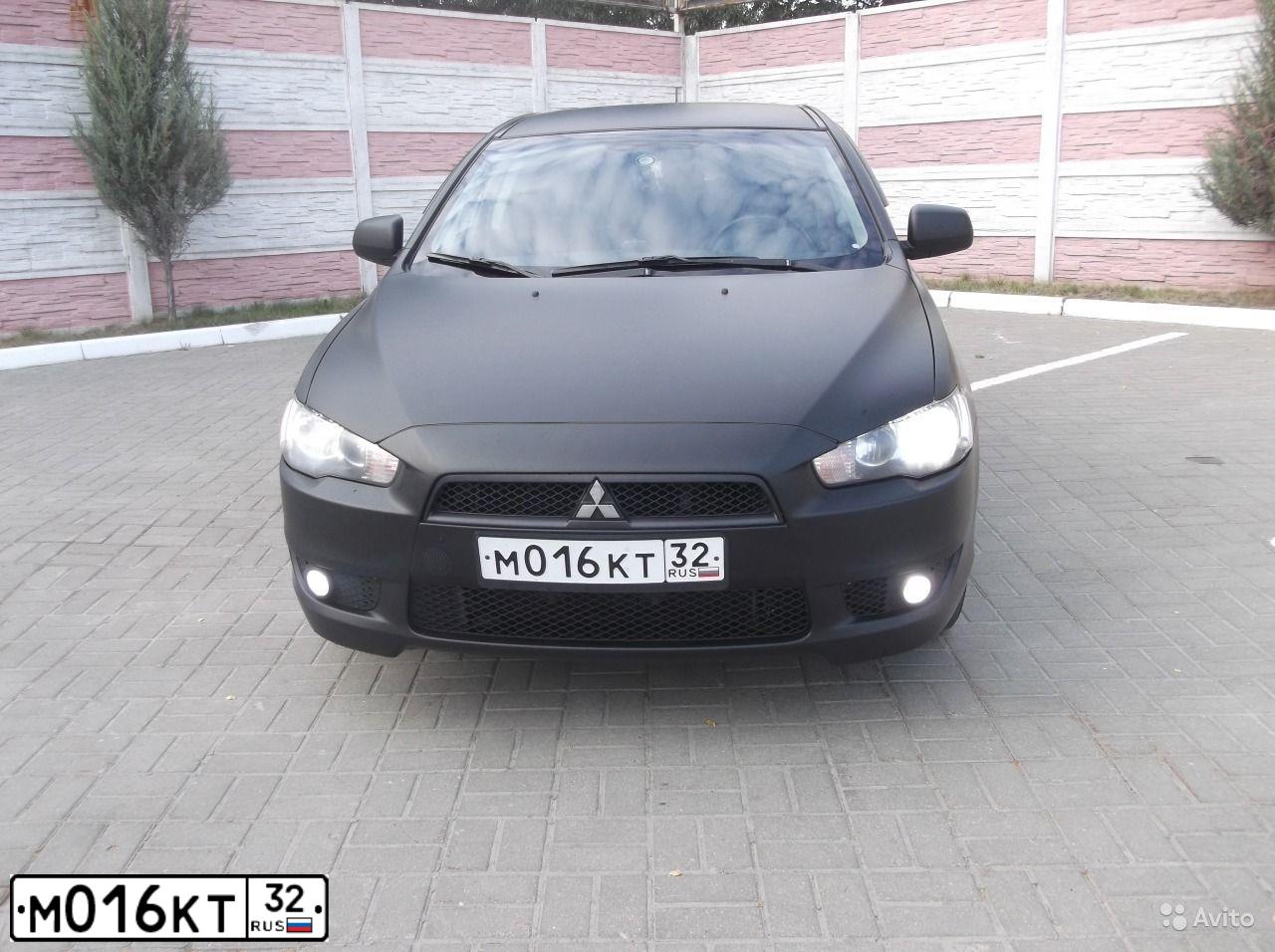 Фото автомобиля MITSUBISHI LANCER, 2008 — госномер Н819ТК32. Цвет: ЧЕРНЫЙ