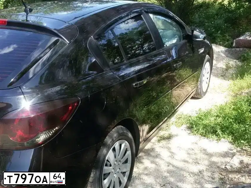 Фото автомобиля CHEVROLET CRUZE, 2012 — госномер Т535ЕУ30. Цвет: ЧЕРНЫЙ
